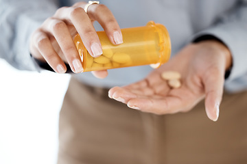 Image showing Closeup, hands and pills for depression, stress and medication for cure, diagnosis and treatment. Zoom, female patient and lady with orange container, medicine or prescription for illness or sickness