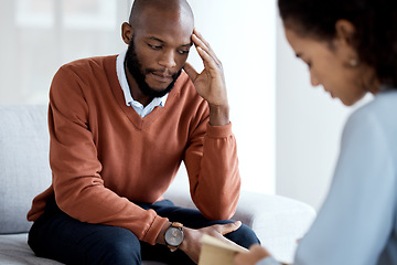 Image showing Black man, mental health and therapy with woman psychologist, stress headache and depression with help. Consultation, doctor with patient and conversation about anxiety problem, sad and depressed