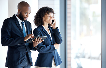 Image showing Phone call, tablet and business people walking in the office together after a team meeting. Technology, career and man doing research on a digital device and woman on mobile conversation in workplace