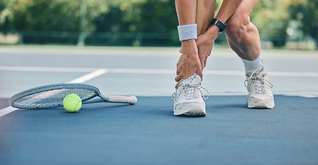 Image showing Tennis player or woman with ankle pain on sports ground for healthcare risk, muscle accident or training problem. Competition, game and athlete on fitness court with foot injury and legs massage