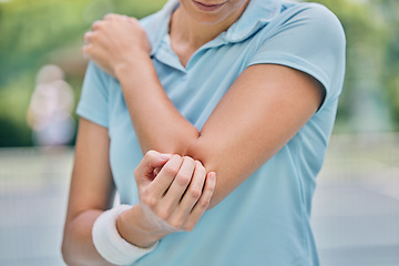 Image showing Sports, woman and injury with elbow, pain and muscle strain while training, workout and outdoor fitness. Female, lady and athlete with emergency for arm, inflammation and broken bone while on court