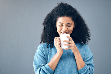 Image showing Black woman, drink and coffee in studio, background and mockup backdrop. Happy young african female model smile with cup of tea, cappuccino and mug of latte for beverage break, happiness and mock up