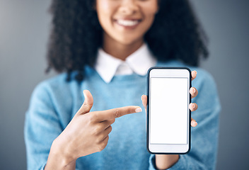 Image showing Mockup screen, smartphone or black woman pointing hand at digital marketing, branding or advertising content. Startup, web or girl in studio with phone for product space, internet or social media