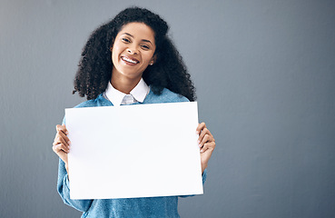 Image showing Portrait, poster and black woman with billboard for space, advertising and branding on grey background. Face, blank sign or banner by girl relax on mock up, copy or announcement on product placement