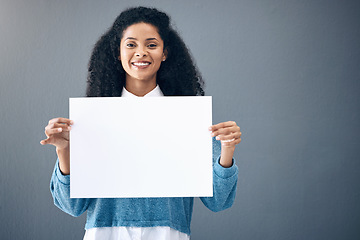 Image showing Portrait, mockup and black woman with poster for space, advertising and branding on grey background. Face, blank or billboard sign by girl relax on mock up, copy or announcement on product placement