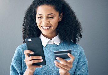 Image showing Credit card, online shopping and woman with phone in studio for advertising on grey background. Ecommerce, banking and finance payment with app, transfer or savings on mockup or isolated copy space