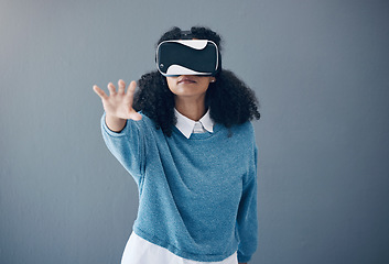 Image showing Virtual reality headset, metaverse and woman with hand for mockup space and 3d game in studio. Gamer person vr glasses for digital world, futuristic gaming and ar tech ux experience grey background