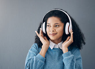 Image showing Music, relax and black woman in studio with peace, streaming or good mood on grey background. Radio, podcast and girl with positive, mindset or audio, online or playlist on advertising isolated space