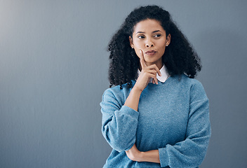 Image showing Thinking, thoughtful and woman in a studio with an idea, smart question or plan in her head. Contemplating, pensive and doubtful female model from Mexico isolated by gray background with mockup space