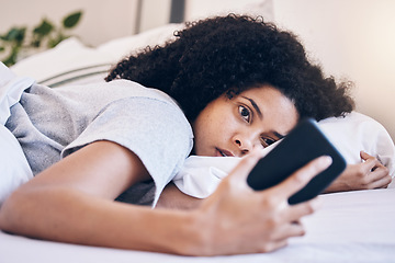 Image showing Cellphone, mental health and woman in her bed with depression while watching videos on social media. Tired, sleepy and depressed female with insomnia networking on a phone in her bedroom at home.