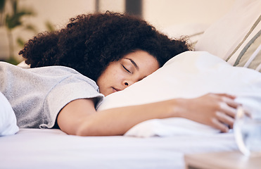 Image showing Black woman, sleeping and bed in morning for peace, quiet and rest or relax in home bedroom. Person with pillow to dream or for calm sleep with insomnia or fatigue therapy for health and wellness