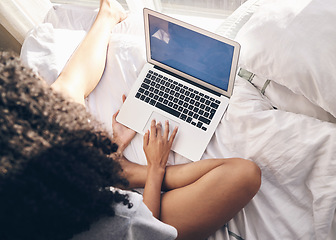 Image showing Top view, bed and woman browsing on a laptop for social media or the internet in the morning. Technology, bedroom and female remote freelancer working on a freelance project on a computer at home.