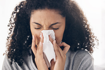 Image showing Black woman, tissue and sneeze of a sick young person blowing nose with toilet paper for safety. Flu, fever and cold of a female feeling tired from sirus infection at home with a health problem