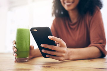 Image showing Green smoothie, smartphone and woman detox, healthy breakfast or diet inspiration on internet, blog or social media. Young person hand holding phone and juice, vegan or fruit drink for nutrition