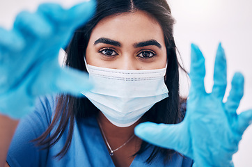 Image showing Woman, doctor and hands with face mask for healthcare, exam or busy with surgery at the hospital. Female medical expert, surgeon or nurse with latex gloves ready for checkup or examination at clinic