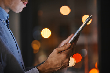 Image showing Night, closeup and man with tablet, hands and social media for business, online reading and new project. Dark, male employee and leader with device, digital planning and search internet in workplace