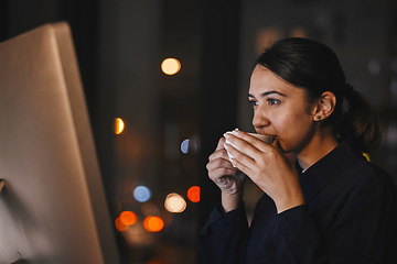 Image showing Coffee, computer and night with a business woman in the office, working overtime late for a deadline. Research, thinking and caffeine with a dedicated female employee at work on a global project