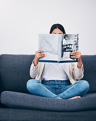 Image showing Relax, magazine or woman reading newspaper articles on sofa at home for information or story updates. Press, focus or person relaxing and studying abstract art for knowledge in a publication on couch