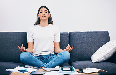 Image showing Study, meditation and Indian woman in a living room with zen to relax from book learning. Sofa, home and female student meditate on a couch doing yoga for wellness in a house with education notebook