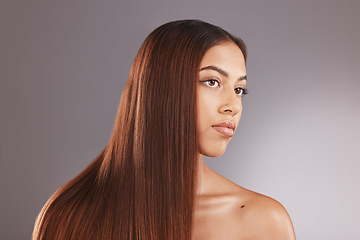 Image showing Face, beauty and hair with a model black woman in studio on a gray background for natural treatment. Aestehtic, salon and haircare with an attractive young female posing to promote keratin benefits