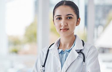 Image showing Leader, female and portrait of a doctor in the hospital after a healthcare consultation. Confident, young and proud professional woman medical worker standing in a medicare clinic after a checkup.