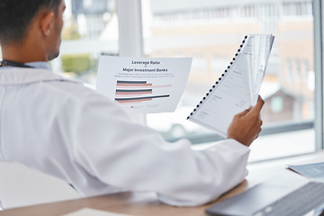 Image showing Doctor or man reading medical documents relax in office for surgery, medicine or healthcare charts for feedback. Paper, research or nurse with insurance, hospital contract or health report review