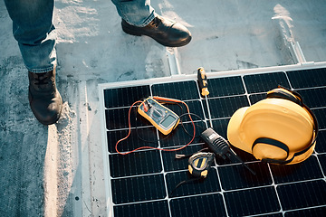 Image showing Solar panel maintenance, tools and outdoor with engineer feet, helmet or renewable energy vision in top view. Photovoltaic technology expert, sustainability or eco friendly electricity tech on ground