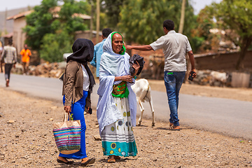 Image showing tigray woman walking in center of of Aksum, Ethiopia Africa