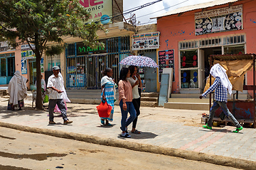 Image showing tigray woman walking in center of of Aksum, Ethiopia Africa