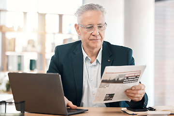 Image showing Business, senior man or manager with newspaper, laptop or focus for information, modern office or planning. Corporate, male leader or entrepreneur with document, reading or concentration in workplace