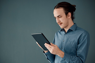 Image showing Digital tablet, mockup and man in studio on internet, search or communication advertising on black background. App, website and businessman online schedule, planning and project, isolated and space