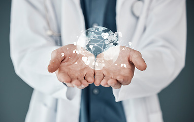 Image showing Doctor, hands and 3D hologram of world for global healthcare, digital help or life insurance against a studio background. Hand of medical expert with futuristic globe for networking or innovation