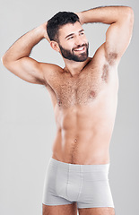 Image showing Strong man, body and fitness with underwear for exercise, weight loss and wellness on studio background. Happy aesthetic person for health, motivation and stomach or muscle growth on healthy diet