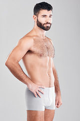 Image showing Exercise, body and underwear with a man model in studio on a gray background for health or grooming. Aesthetic, muscle and manly with a handsome young male posing to promote wellness or lifestyle