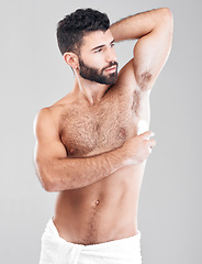 Image showing Deodorant, roll and man grooming in studio for hygiene, fresh scent or underarm perfume. Male model, armpit and cosmetics for sweat control, body odor and cleaning product for skincare on background