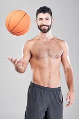 Image showing Fitness, portrait of man throwing basketball in air and smile, topless and isolated on grey background. Exercise, motivation and ball sports coach or personal trainer with workout mindset in studio.