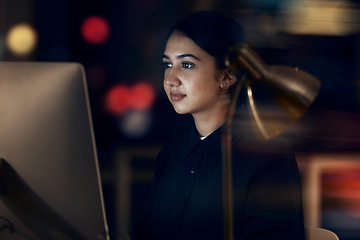 Image showing Woman, night office and focus at computer for seo planning, research or agenda in dark startup. Female working overtime on desktop technology, online and network data of internet analytics on website