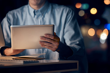 Image showing Hands, tablet and business man in office working late on project, email or research at night. Bokeh, technology and male employee with digital touchscreen for networking, social media or web browsing