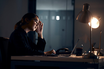 Image showing Stress, laptop and business woman at night working on project, planning report and strategy deadline. Burnout, dark office and tired female worker at desk with headache, fatigue and thinking of ideas