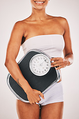 Image showing Woman, body and lose weight with scale for healthy diet, health and wellness. Model person on studio background for fitness, goals and motivation in underwear for exercise results and progress