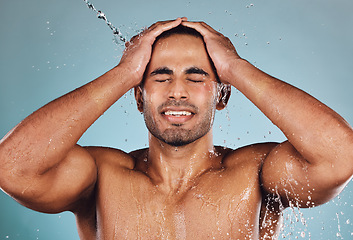 Image showing Man, water splash and face wash for skincare hygiene, hydration or shower against studio background. Young male model in beauty, wellness and washing or cleansing for clean facial body care treatment