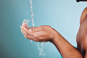 Image showing Man, water splash and hands in shower for skincare hygiene, wash or hydration against a studio background. Hand of young male model in beauty, wellness and washing or cleansing for sustainability