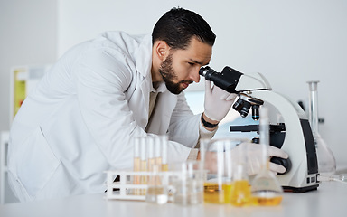 Image showing Science, microscope and medical with a doctor man at work in a laboratory for innovation or development. Research, analytics and biotechnology with a male scientist working in a lab for breakthrough