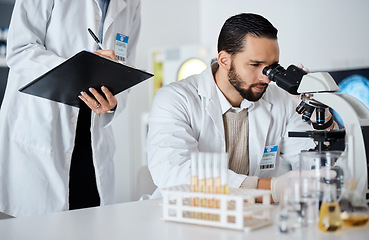 Image showing Scientist, woman and man by microscope with checklist in laboratory for research at pharma company. Science team, data analytics and biotechnology for goals, vision and study virus for lab innovation