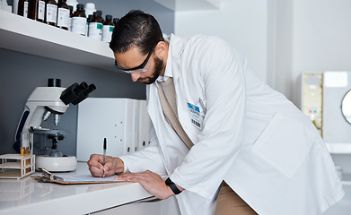 Image showing Science, writing and man in laboratory for research, medical report and analytics on clipboard. Pharmaceutical medicine, healthcare and scientist write notes for data analysis, test results and study