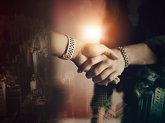 Image showing Business people, handshake and agreement with city overlay for partnership, teamwork and welcome. Corporate women, shaking hands and thank you for commitment, goals and deal with hologram of metro