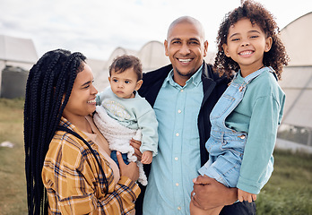 Image showing Mother, dad and children in portrait at farm, outdoor and happy for baby kid, growth and sustainable small business. Black family, kids and smile for farming sustainability with love by greenhouse