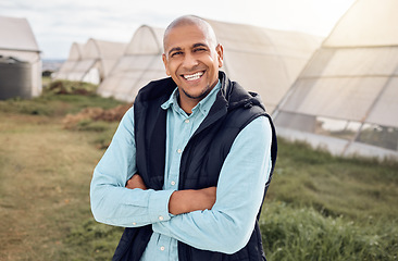 Image showing Black man, farmer and outdoor portrait with arms crossed, smile and happiness for sustainable farm. Farming expert, sustainability and happy in field by greenhouse with goals, vision and motivation