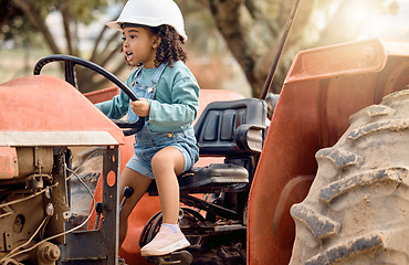 Image showing Girl kid in tractor, agriculture and farming transport, sustainability and learning field work with development and fun. Childhood, farm machinery and farmer in training with growth and young child