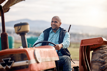 Image showing Tractor, man and driver on field for agriculture, countryside or sustainability in nature. Happy farmer worker driving machine truck, transport and sustainable ecology with happiness of land harvest